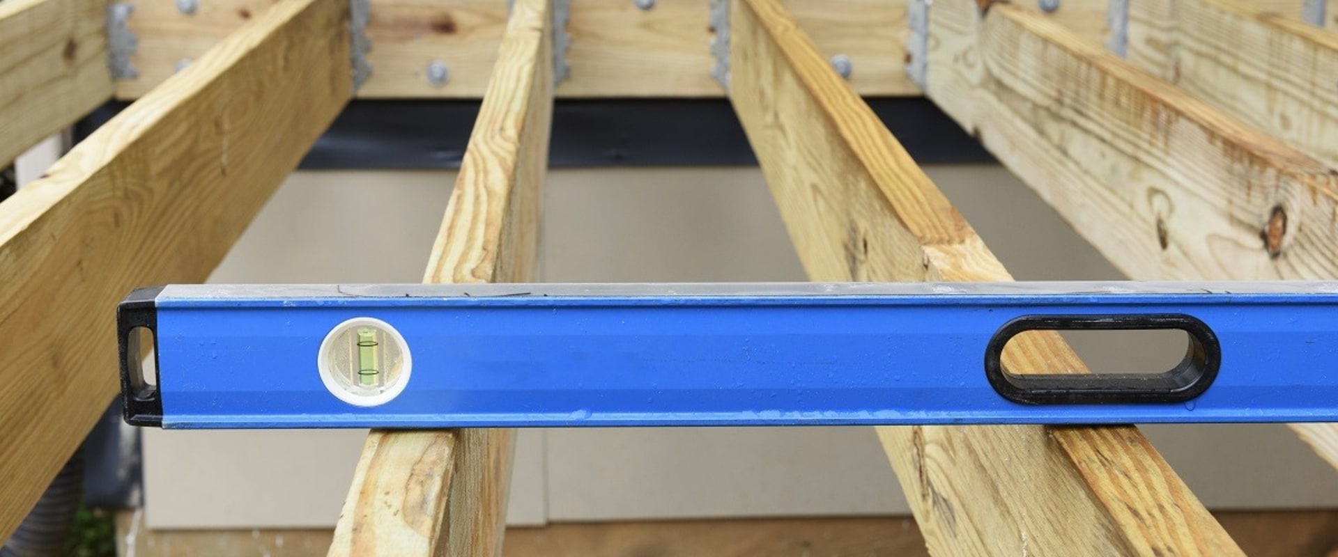Secure Joist Hangers to Ledger Boards for Deck Construction